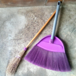 purple broom and dustpan